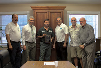 George McGarry receives 10 Year Award from left Stephen Hinkle, Michael Danchuck, Mike Dillon, Michael Ryan and Tom Rice.